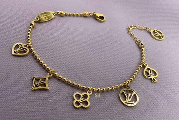 LV Gold Charm Bracelet with Iconic Symbols